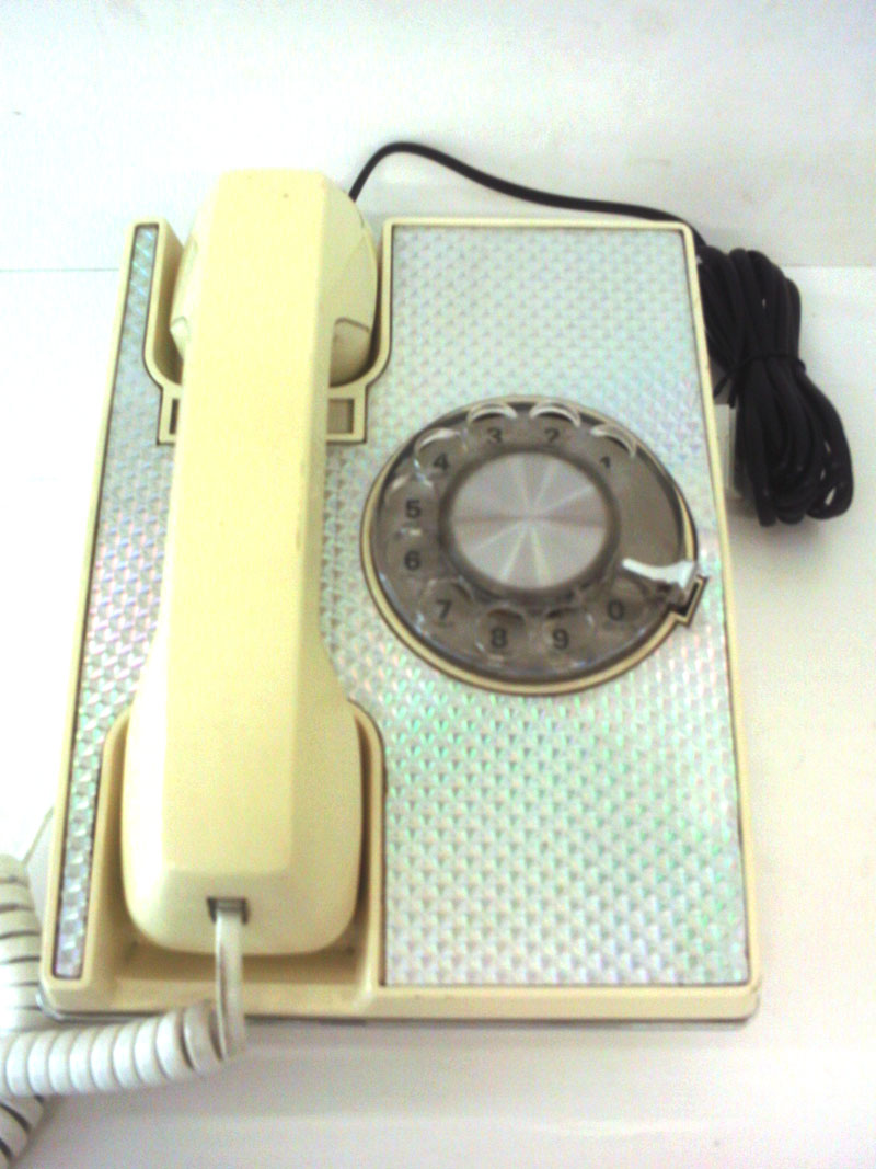 Dial telephone with metallic effect